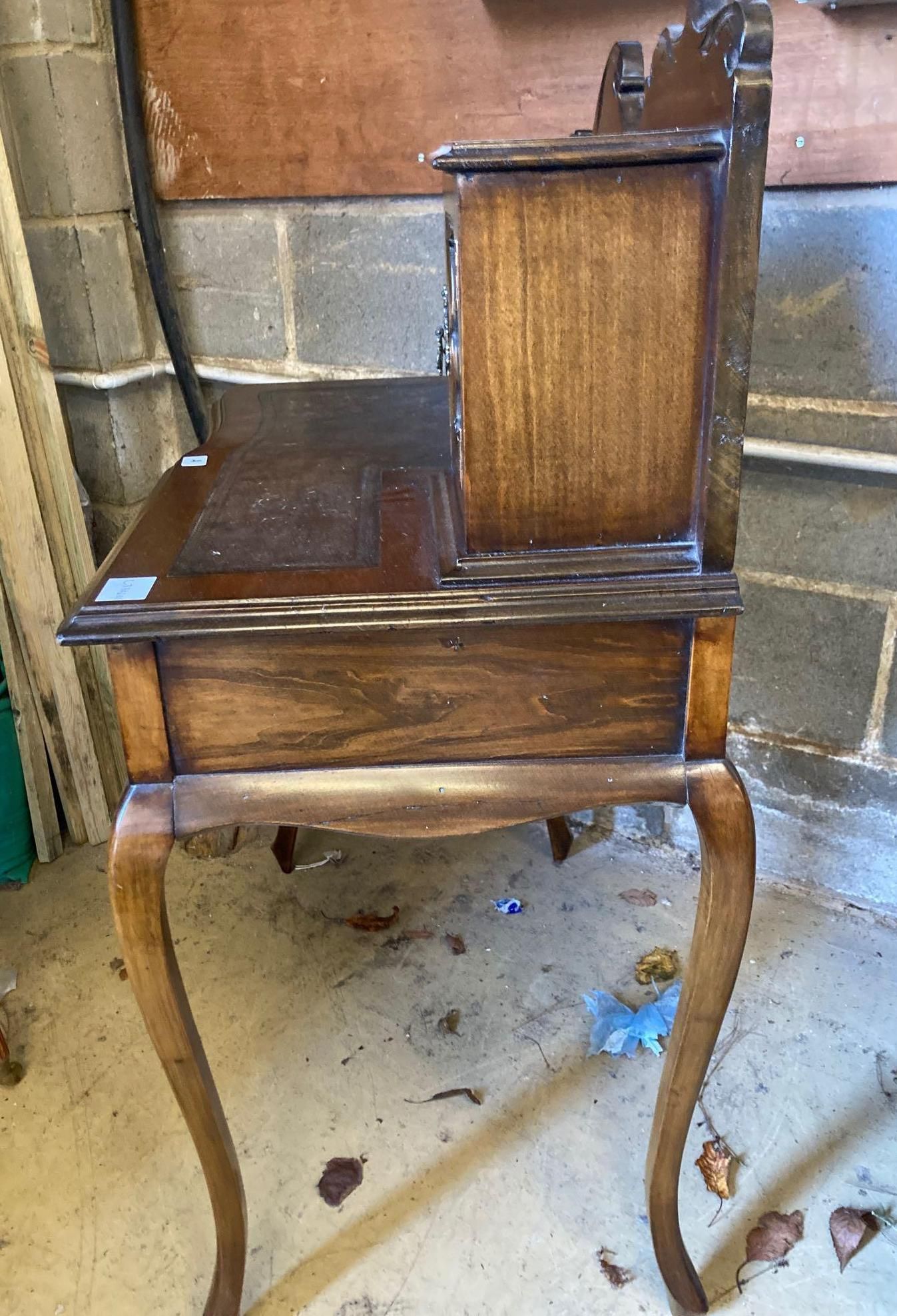 An early 20th century stained beech writing table, with raised superstructure, width 77cm height 108cm